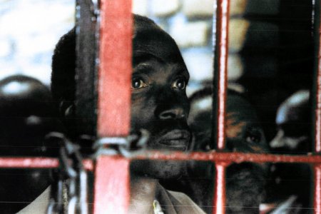 One of more than 7.000 mostly Hutu inmates at the overcrowded Gitarama prison stares out from behind the bars. Some 120 inmates were transferred by the UN in an effort to try to relieve overcrowding.